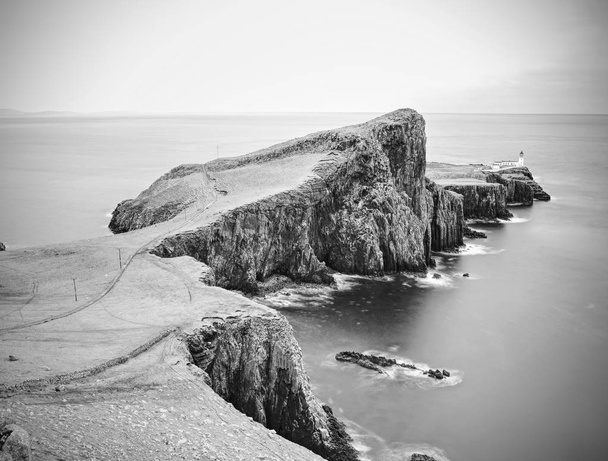 Cliffs of Neist Point Cape and lighthouse in black and white. Popular travelers destination on Isle of Skye,  Scotland. - Photo, Image