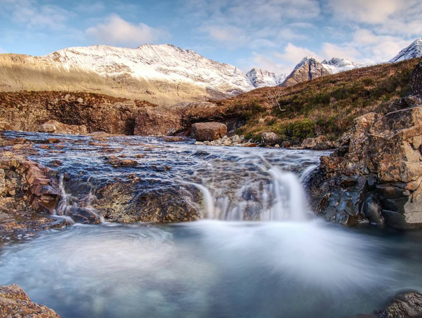 Multiple waterfalls, seemingly vibrant blue and  green in color, with cold swimmable pools. Popolar trek at Glenbrittle, Isle of Skye, Scotlland - Photo, Image