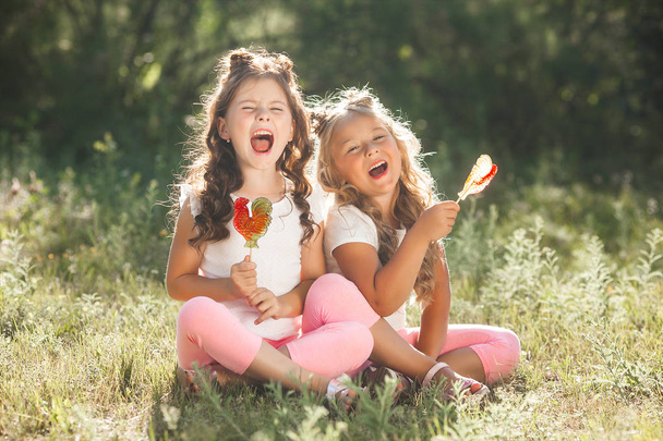Cute little girls friends having fun together outdoors, - Photo, Image