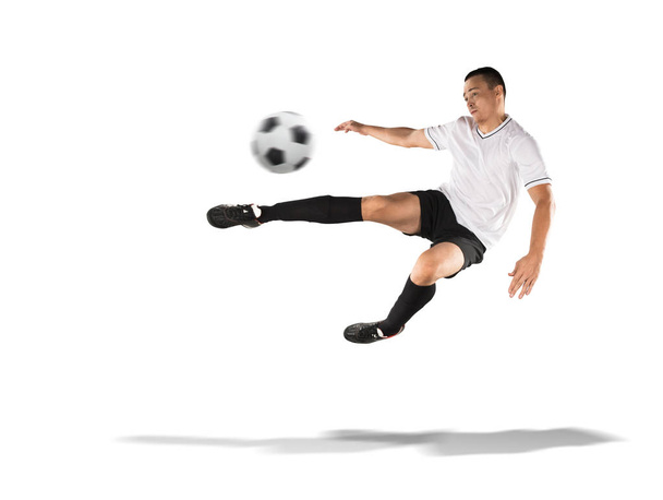 soccer player kicking the ball in the air isolated on white - Foto, afbeelding