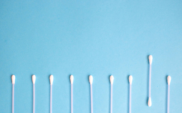 the pattern of the cotton buds on a blue background - Photo, Image