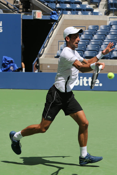 NEW YORK - AUGUST 22, 2018: 13-time Grand Slam champion Novak Djokovic of Serbia practices for the 2018 US Open at Billie Jean King National Tennis  - Foto, Imagen