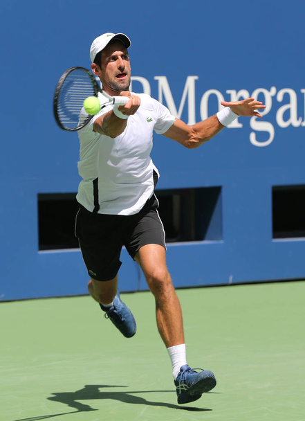 NEW YORK - AUGUST 22, 2018: 13-time Grand Slam champion Novak Djokovic of Serbia practices for the 2018 US Open at Billie Jean King National Tennis  - 写真・画像