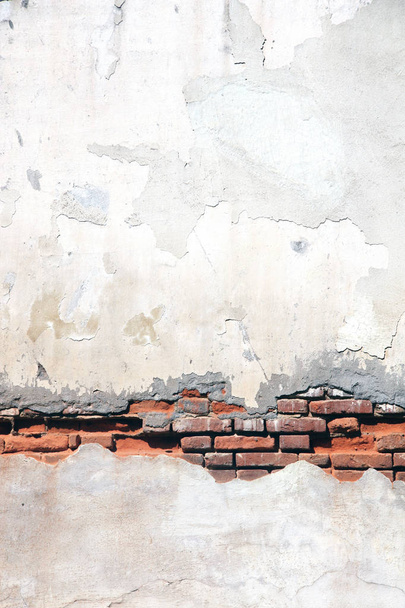 Grunge background with texture of old brick wall and cracked stucco of white color - Zdjęcie, obraz