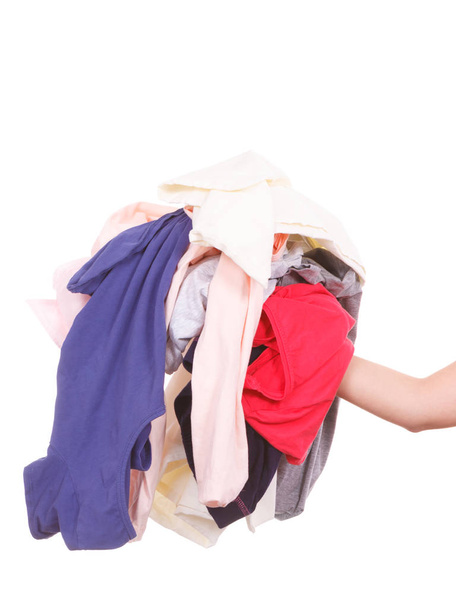 Household duties, perfect housewife concept. Woman holding pile of creased clothes after laundry about to do ironing - Photo, image