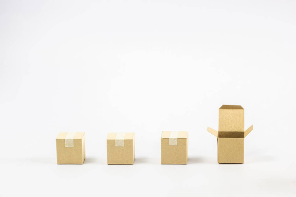 Shipment and delivery concept : 3 Closed and one open paper carton box on white background and space. Conceptual Think difference Close and open cardboard boxes. - Zdjęcie, obraz