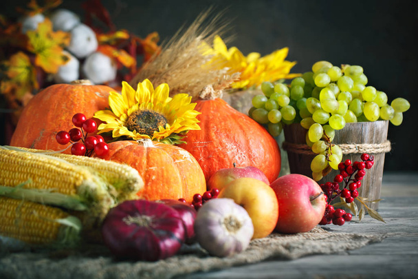 Happy Thanksgiving Day background, wooden table decorated with Pumpkins, Maize, fruits and autumn leaves. Harvest festival. Selective focus. Horizontal. - Φωτογραφία, εικόνα
