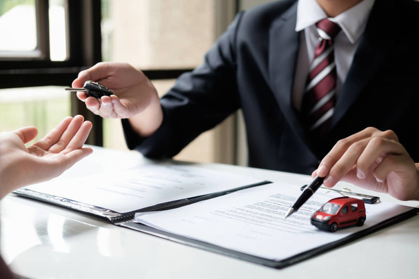 Business concept, car insurance, sell and buy car, car financing, car key for Vehicle Sales Agreement. - 写真・画像