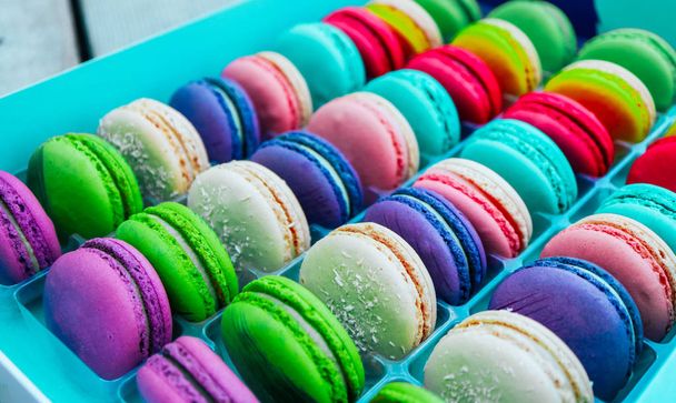 Assorted macaroons sweets, close up, backdrop. Marine, pink and violet. - Фото, изображение