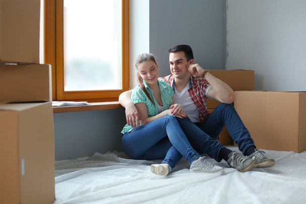 Couple moving in house sitting on the floor. Couple - Foto, Imagem