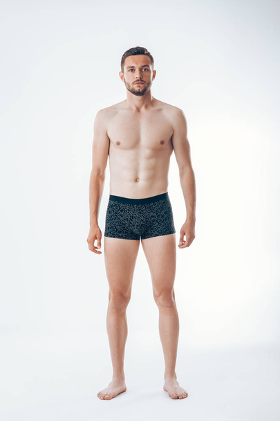 Full length portrait of young sexy muscular male model in underwear.  Man beauty - Photo, Image