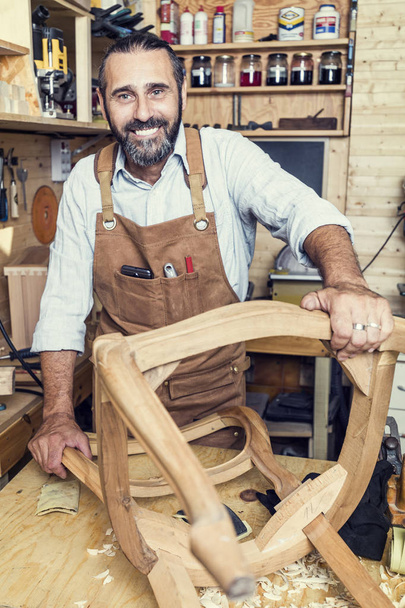 caucasian carpenter at work in a workshop - Φωτογραφία, εικόνα