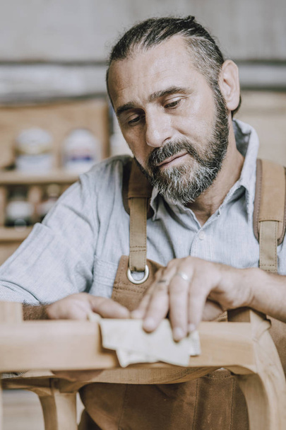 caucasian carpenter at work in a workshop - 写真・画像