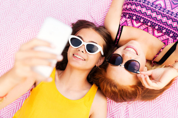 teenage girls in sunglasses taking selfie - Photo, Image