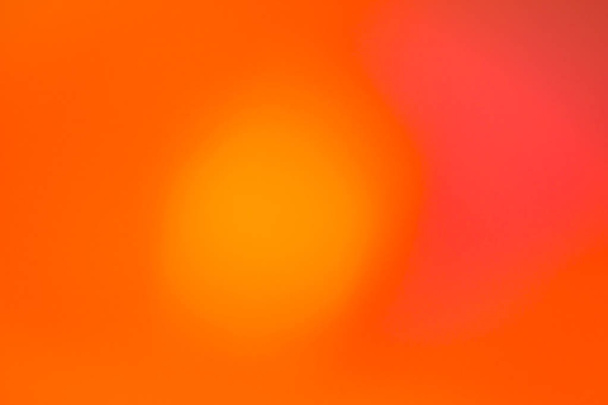 Absztrakt defocused narancssárga és piros kör alakú könnyű minta  - Fotó, kép