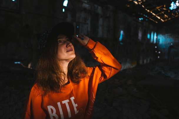 Portrait of a teenage girl posing in an abandoned building - Foto, Imagen