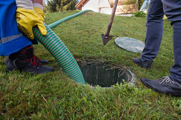 Emptying household septic tank. Cleaning and unblocking clogged drain. - Photo, Image