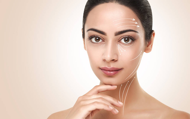 Antiaging massage lines on beautiful woman face - Photo, Image