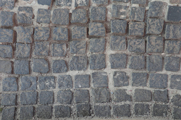 Photo of a stone paving. Stone texture, top view. - Foto, afbeelding