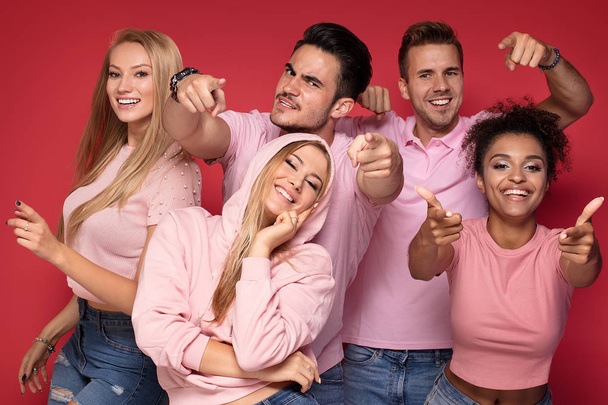 Group of young multi-ethnic attractive people smiling and having fun together, posing on colorful background. - Zdjęcie, obraz
