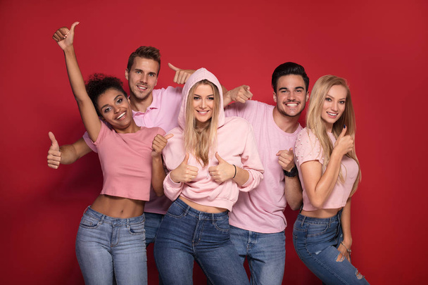 Group of young multi-ethnic attractive people smiling and having fun together, posing on colorful background. - Fotografie, Obrázek