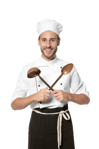 Professional chef with kitchen tools on white background - Valokuva, kuva