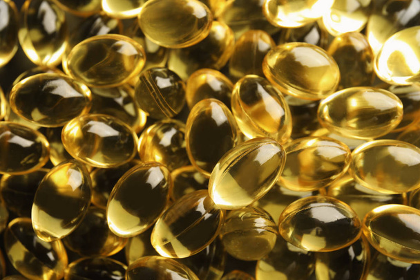 Cod liver oil pills as background, closeup - Photo, Image
