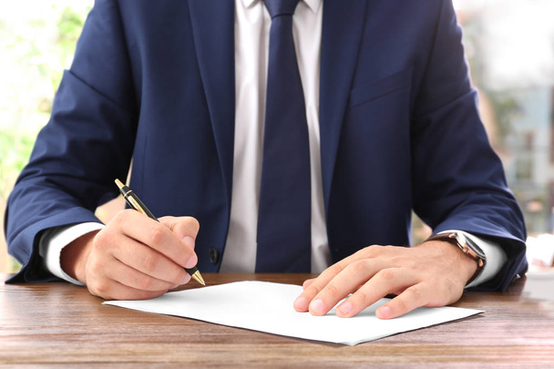 Lawyer working with documents at table, focus on hands - Photo, Image