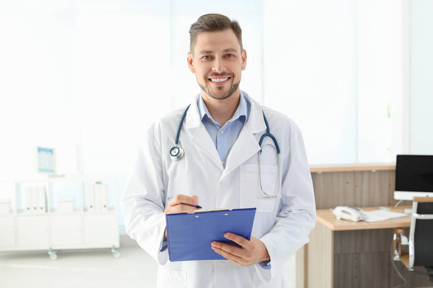Male medical assistant in clinic. Health care service - Valokuva, kuva