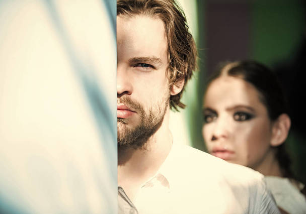 Man hide half face with beard and blurred woman - Zdjęcie, obraz