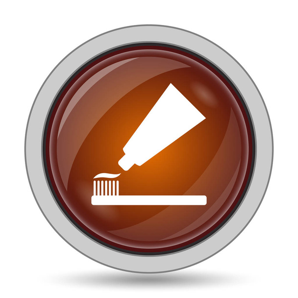 Pasta de dentes e ícone de escova, botão laranja site no fundo branco
 - Foto, Imagem