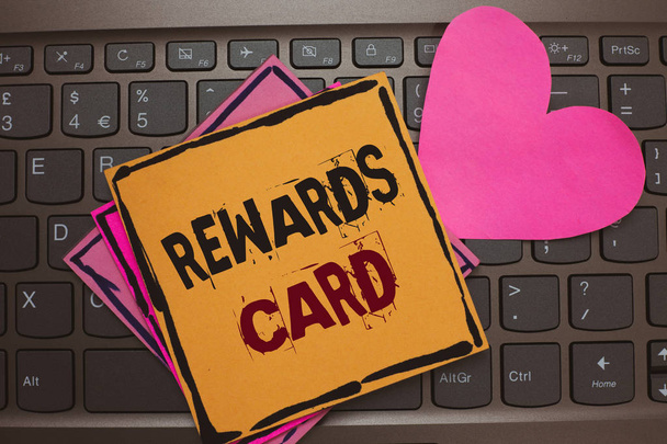 Word writing text Rewards Card. Business concept for Help earn cash points miles from everyday purchase Incentives Papers Romantic lovely message Heart Keyboard Type computer Good feelings. - Photo, Image