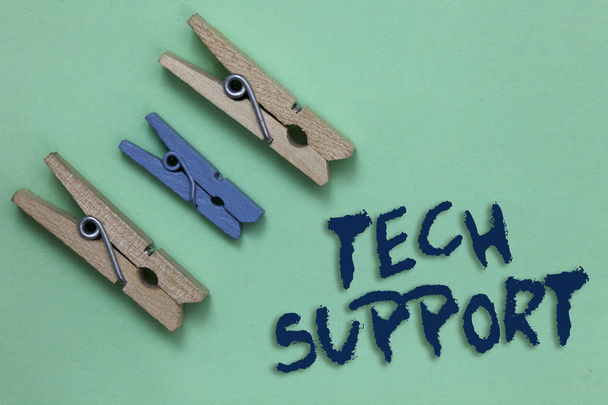 Conceptual hand writing showing Tech Support. Business photo showcasing Assisting individuals who are having technical problems Three brown blue vintage clear background Holding things. - Photo, Image