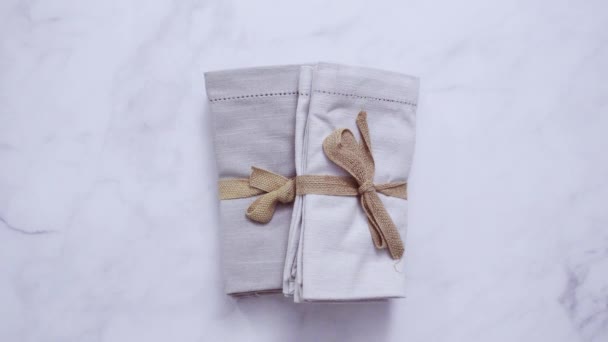 New linen dinner napkin on marble countertop - Footage, Video