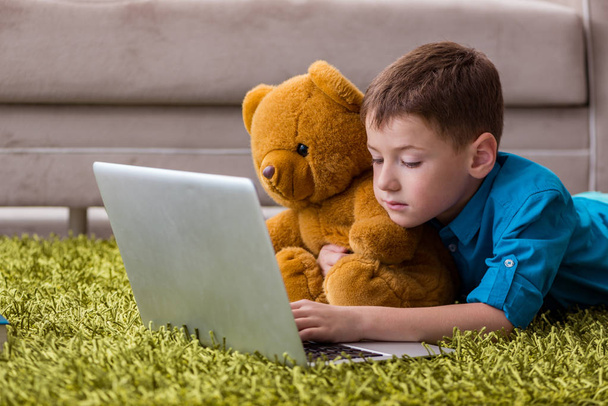 Little boy surfing internet on laptop - Photo, Image