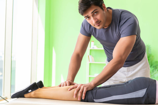 Young doctor chiropractor massaging patient  - Photo, Image
