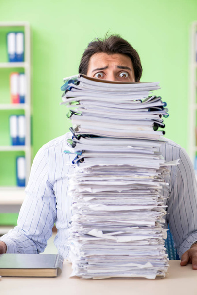 Businessman having problems with paperwork and workload - Photo, Image