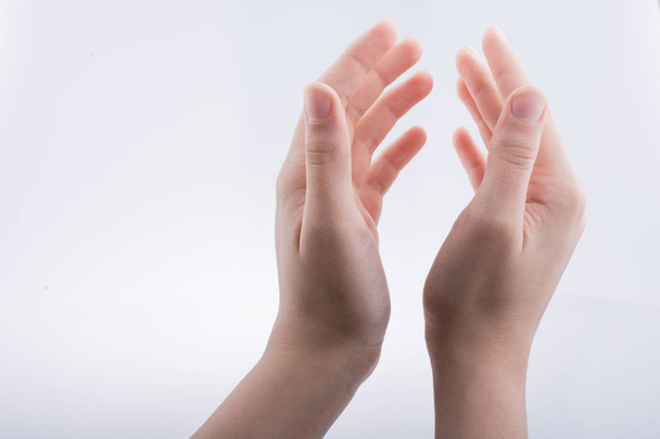 Hand holding on a white background - Фото, зображення