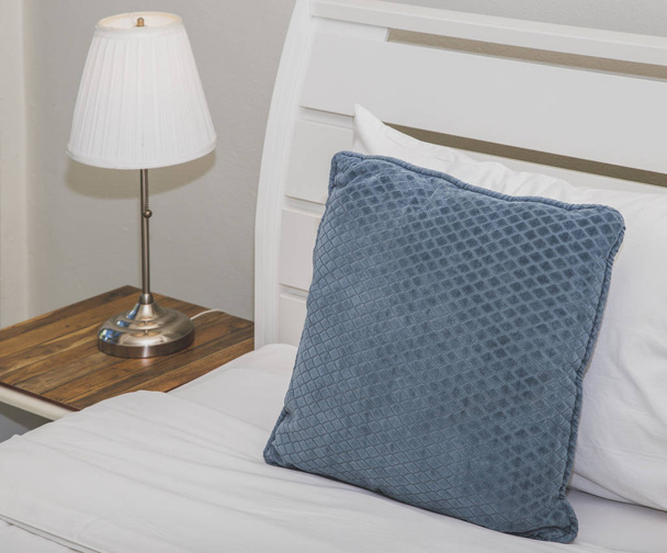 Pillows on bed and lamp in bedroom - Foto, immagini