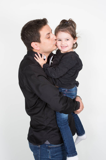 young father kiss child girl daughter in white background - Fotó, kép