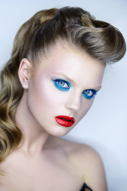 Fashion shot of young woman with bright colorful makeup - Фото, зображення