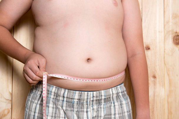 Fat boy, The size of stomach of children with overweight. - Photo, Image