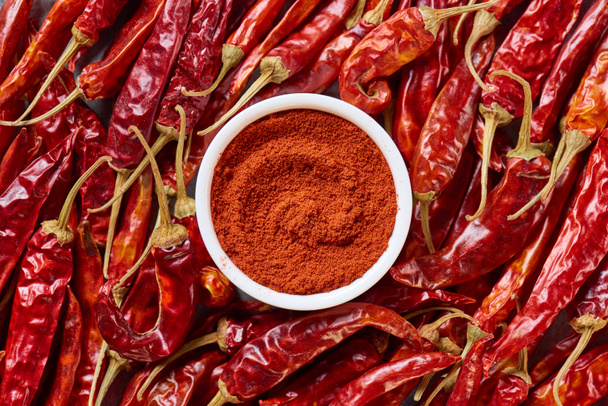 top view of arranged grinded and wholesome chili peppers - Photo, Image