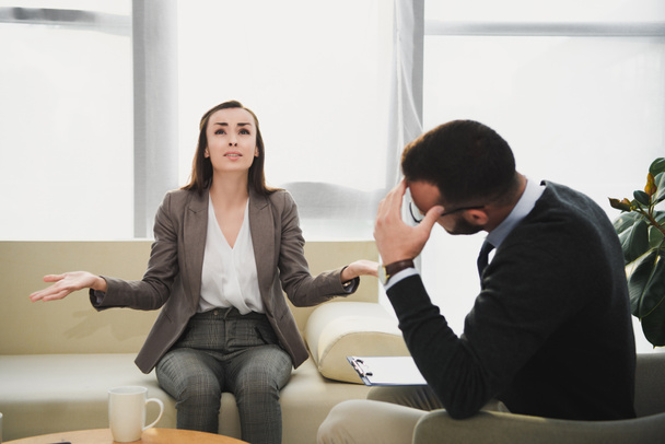 depressed patient crying and gesturing in therapist office - Photo, Image