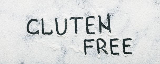 Gluten free written on healthy scattered flour - Photo, Image