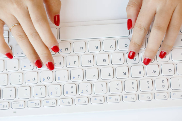Close-up of young women hitting wireless keyboards - Zdjęcie, obraz