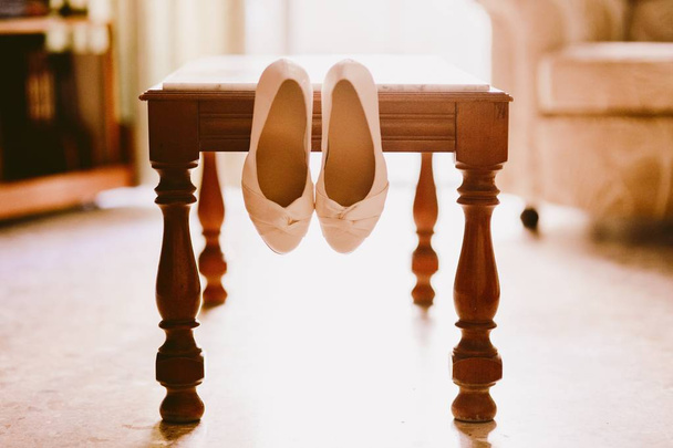 Wedding shoes on their wedding isolated in a room - Фото, зображення