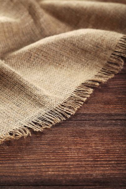 Sackcloth texture on brown wooden table - Zdjęcie, obraz