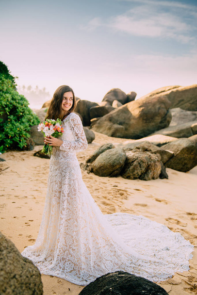 portrait of bride in full growth on tropical beach - Fotoğraf, Görsel
