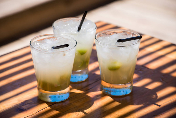 Three glasses of fresh caipirinha ready to drink - Фото, зображення